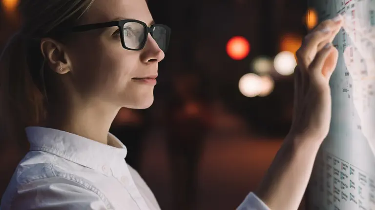 Woman next to a screen