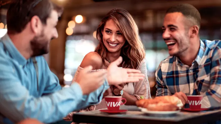 Three people in VIVA restaurant
